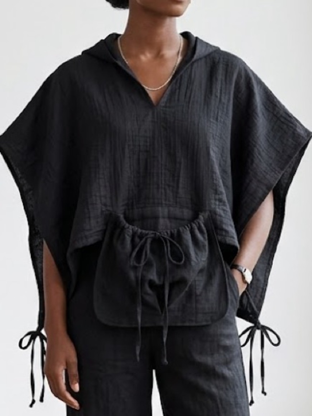 Cropped sleeveless poncho with hood
